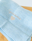 Couverture en laine mélangée avec broderie